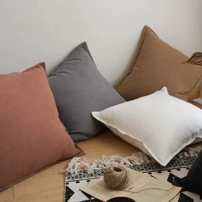 A cozy fringed linen pillow cover ivory with soft texture and frayed edges among earth-toned decorbites linen pillows