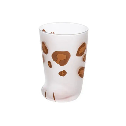A frosted white glass shot glass with orange and black leopard spots and a cat paw shot base by decorbites cat paw