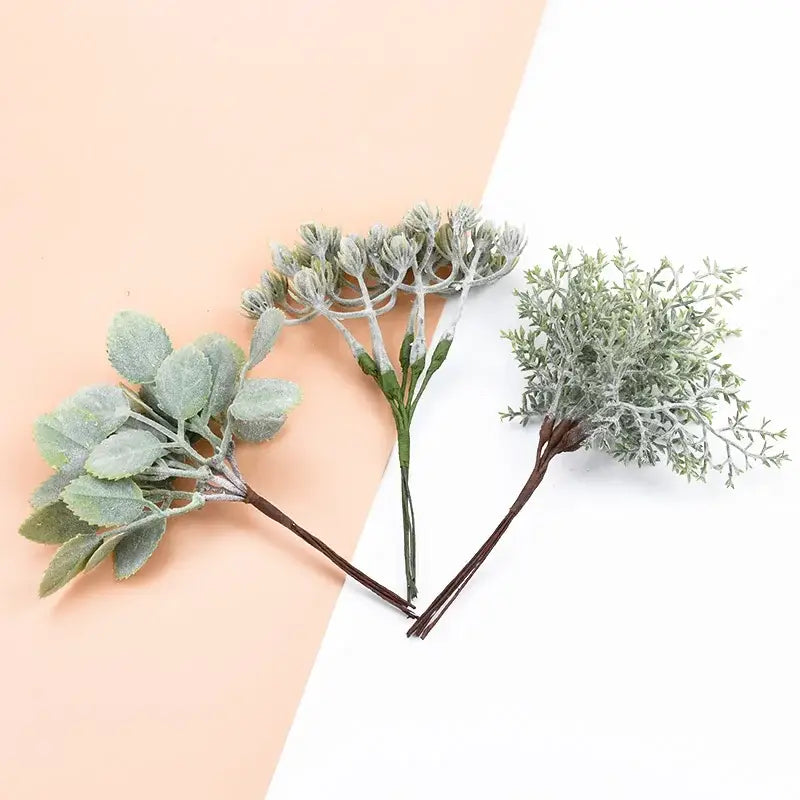 Three frosted silver and brown decorative artificial plants with textured leaves from decorbites artificial plants bundle