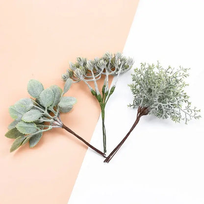 Three frosted silver and brown decorative artificial plants with textured leaves from decorbites artificial plants bundle