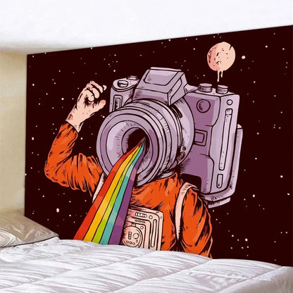 A vibrant orange decorbites futuristic astronaut tapestry wall hanging with a purple camera and rainbow beam on starry black background