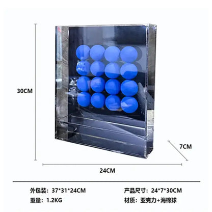 Clear acrylic display case holding a grid of bright blue abstract acrylic ball ornaments for geometric decor