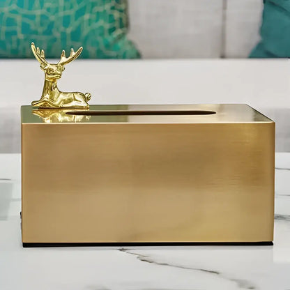 Gold-colored brass color tissue box with geometric animal deer figurine for living room decor by decorbites