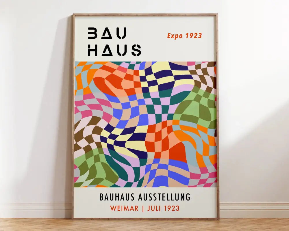 Vibrant mid century bauhaus art canvas print with bold black and orange text framed in light wood for wall decor