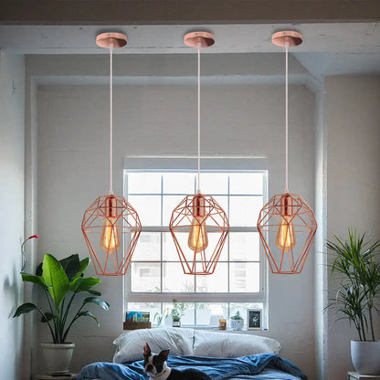 Three copper geometric pendant lights with exposed filament bulbs for decorbites birdcage diamond ceiling decor