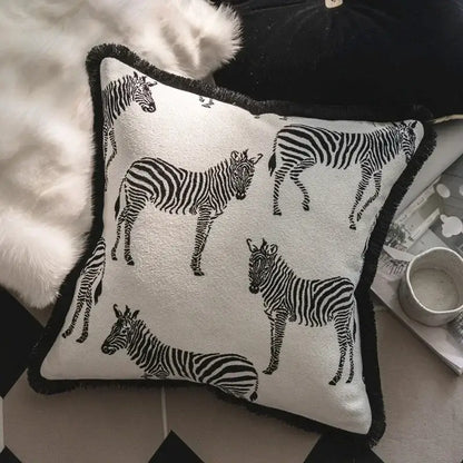 Square white pillow cover set with black zebra silhouettes and fringed black border for living room decor