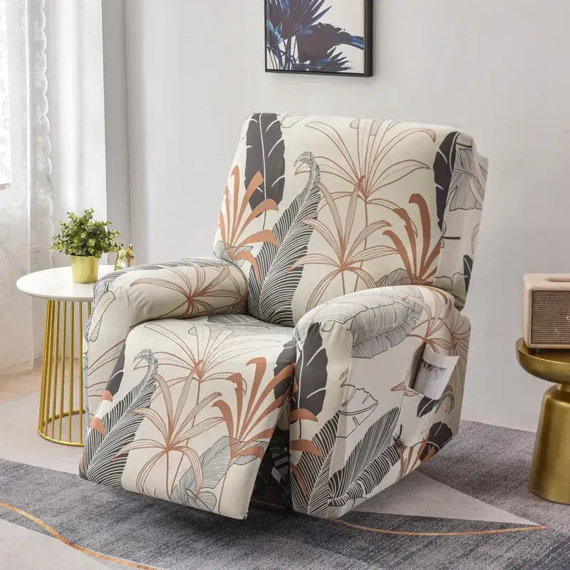 A cozy cream recliner with tropical gray and brown leaf pattern next to a geometric black and red stretch recliner cover