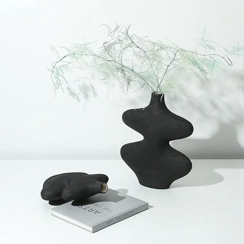 Black ceramic vase with organic sculptural curves and matte finish in geometric ceramic vase set for living room decorbites decor