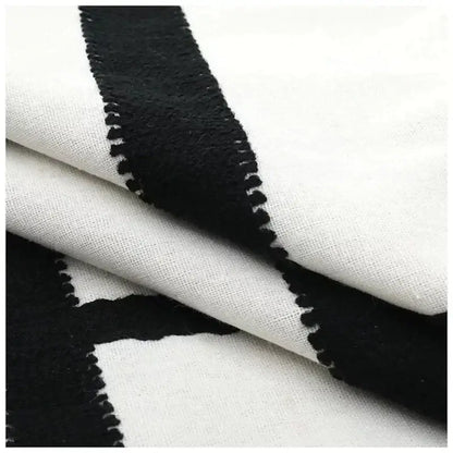 Geometric black and white embroidered burlap cushion cover with bold pattern and stitched edges for living room decor