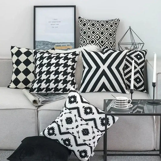 Black white embroidered cushion cover with geometric pattern on light gray sofa for decorbites living room decor
