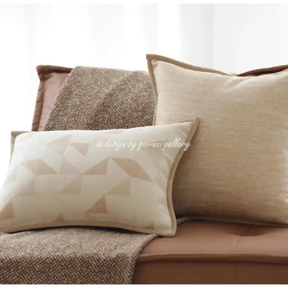 Cream-colored geometric brown leather splicing throw pillow cover with textured linen fabric and beige triangle pattern decorbites geometric brown