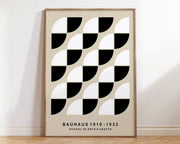 Minimalist decorbites bauhaus geometric canvas print with black white semicircles on beige in light wood frame for home decor