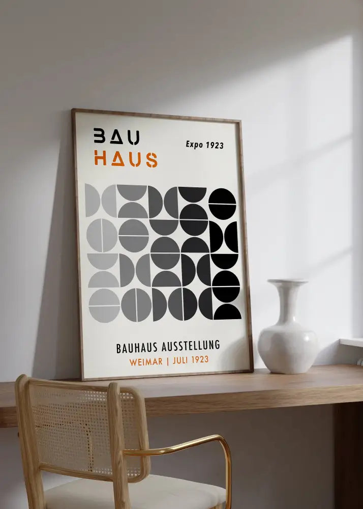 Minimalist framed bauhaus geometric canvas print featuring black gray white circles and bold orange text for home decor