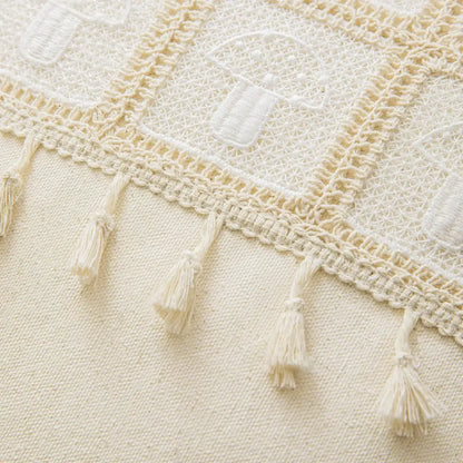 Cream-colored crochet throw blanket with embroidered lantern motifs and tassels for decorbites geometric checker cushion cover