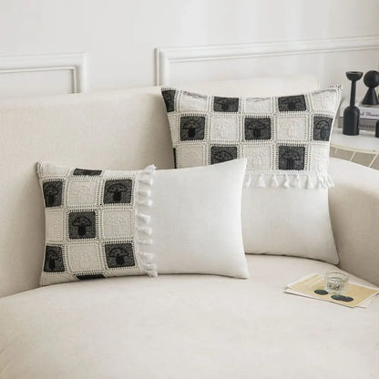 Black and white crochet throw pillow with mushroom motifs and tassel trim for decorbites geometric checker cushion cover
