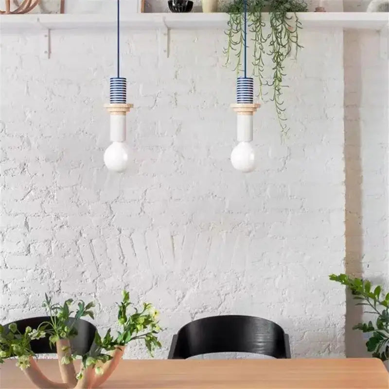 Two blue and white striped led wooden pendant lights with white bulb shades and wooden accents for bedroom decorbites decor