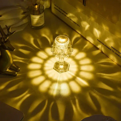 A crystal diamond led night light with a clear faceted glass design casts warm golden light for bedroom reading