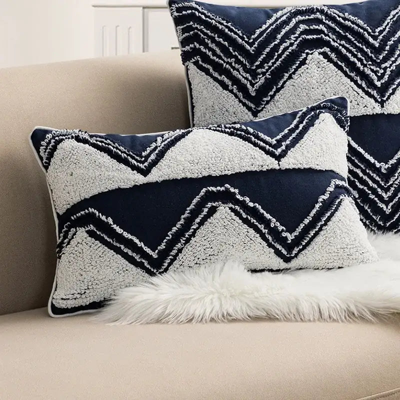 Navy blue and cream cushion cover with geometric embroidered zigzag pattern and tufted tassels for decorbites bedroom decor