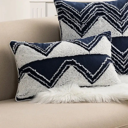 Navy blue and cream cushion cover with geometric embroidered zigzag pattern and tufted tassels for decorbites bedroom decor
