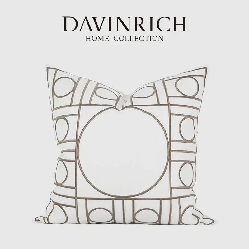 A white geometric embroidered noble cushion cover from davinrich home collection with gray outlined circles and rectangles