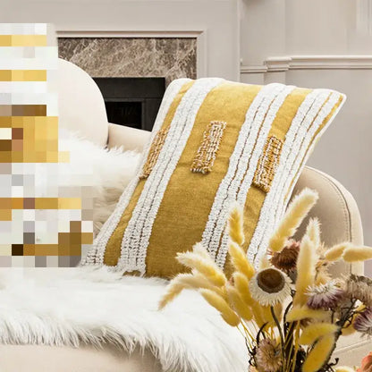 A mustard yellow cushion cover with white woven stripes and beaded accents for decorbites geometric embroidery circle decor