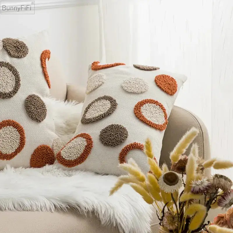 Cream-colored cushion cover with decorbites geometric embroidery circle patterns in orange and brown for living room decor