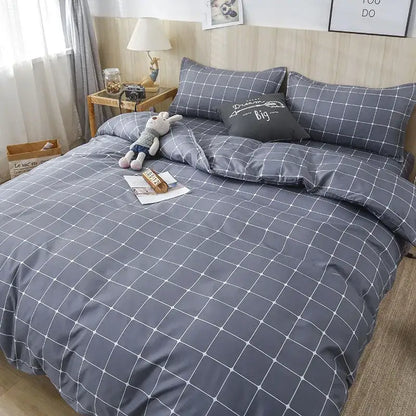 Gray duvet cover set with white grid pattern and black accent pillow in decorbites geometric floral bedding set