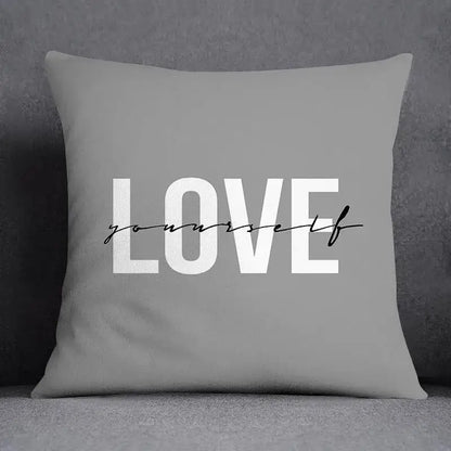 Gray pillow case with love yourself print in white block and black cursive script for decorbites geometric floral print decor
