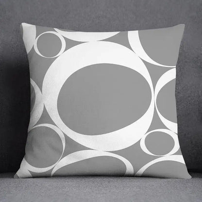 Gray throw pillow case with a decorbites geometric floral print of overlapping white and gray circles for living room decor