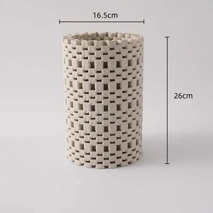 A tall beige ceramic vase with a woven lattice geometric folding design for decorbites geometric folding decor