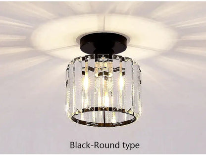 Black round led chandelier with clear crystal prisms and sleek metallic frame for dining room decorbites crystal led lighting