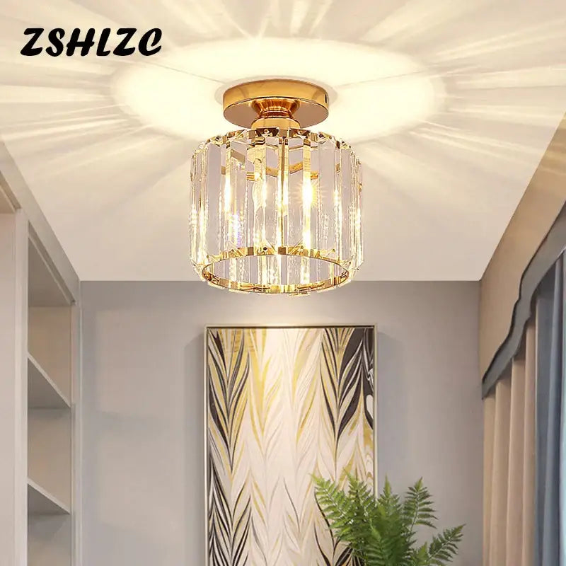 Geometric gold crystal led chandelier with modern cylindrical design and clear faceted glass by decorbites crystal led