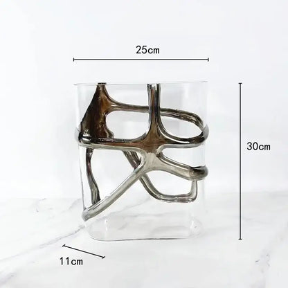 A modern glass vase with a sleek silver metallic abstract sculpture and gold edges for living room decorbites decor