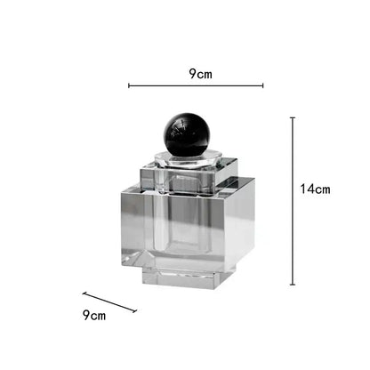 Clear acrylic crystal storage jar with black spherical stopper and tiered square base for bedroom decor