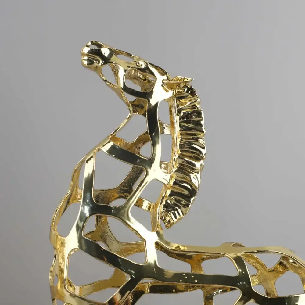 Geometric golden horse metal sculpture decorbites with a modern minimalistic hollow design for living room decor