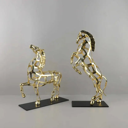 Two golden horse metal wireframe sculptures with black bases perfect for geometric living room decorbites decor