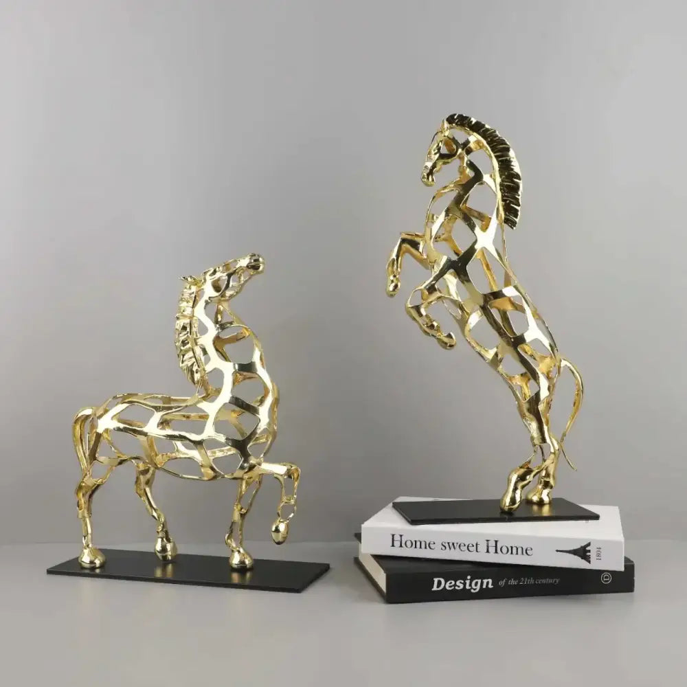 Two golden horse metal sculptures with intricate geometric patterns and polished finish for decorbites golden horse decor