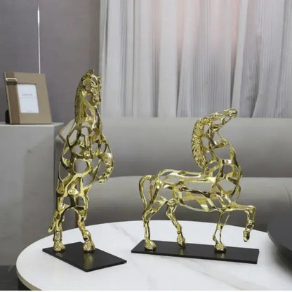 Two golden horse metal sculptures with geometric hollow design in standing and running poses for living room decorbites golden horse decor