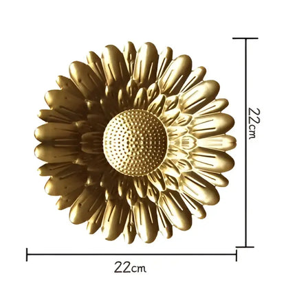 Golden metal wall art shaped like a sunflower 22cm diameter part of decorbites geometric golden metal set