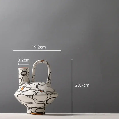 White ceramic geometric graffiti vase with black and orange abstract patterns for terracotta living room decor