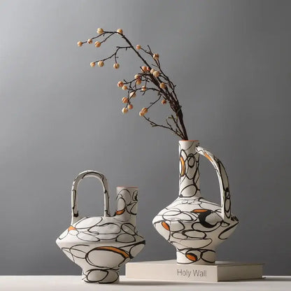 White ceramic geometric graffiti ceramic vases with black and orange patterns for terracotta living room decor