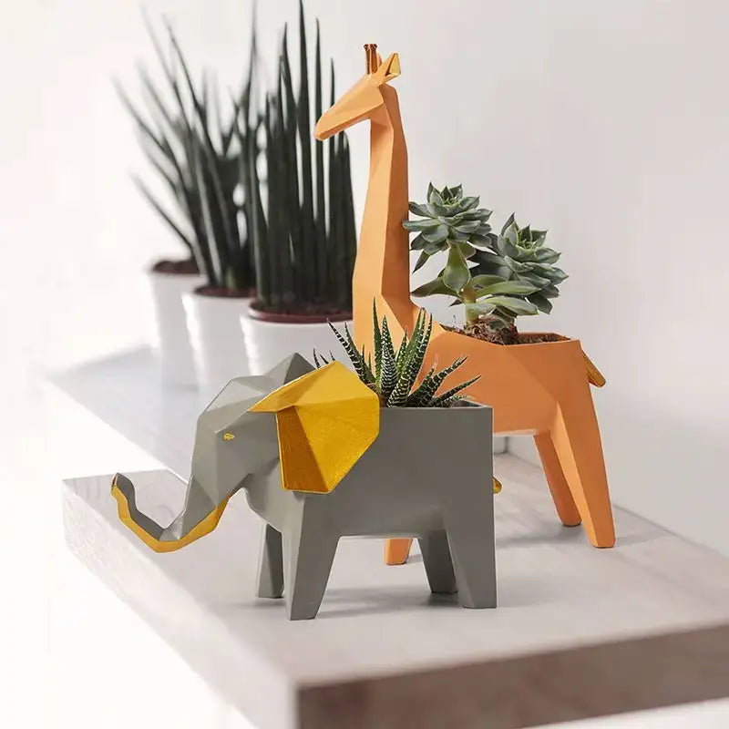 Geometric gray and orange giraffe 3d papercraft planter with yellow accents holding succulents for living room decor