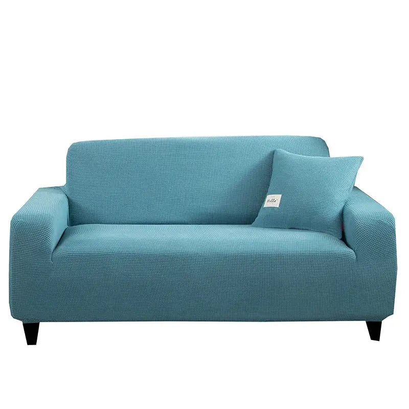 Teal textured stretch sofa cover with matching pillow for living room featuring geometric gray design