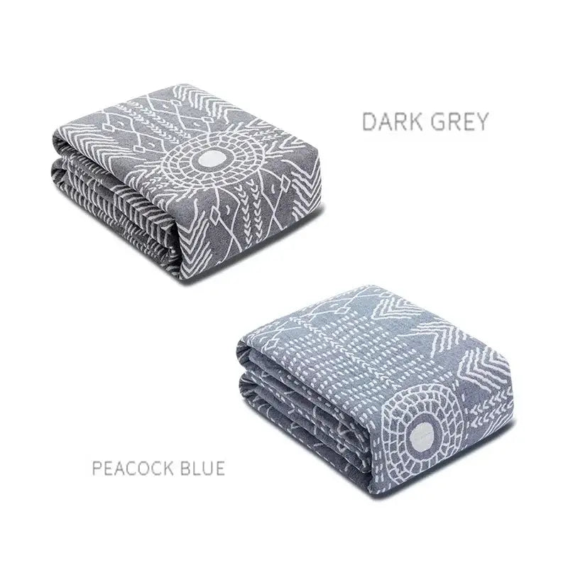 Dark grey and peacock blue decorbites cotton gauze throw blankets with intricate white geometric patterns for bedroom decor