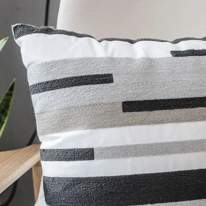 Rectangular pillow cover with decorbites grey embroidered cotton fabric featuring woven horizontal stripes in grey tones