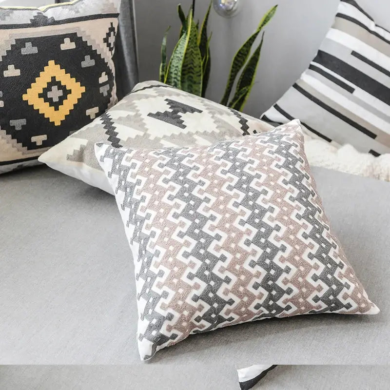 Square pillow cover with geometric grey embroidered cotton pattern in shades of gray beige and white for living room decor