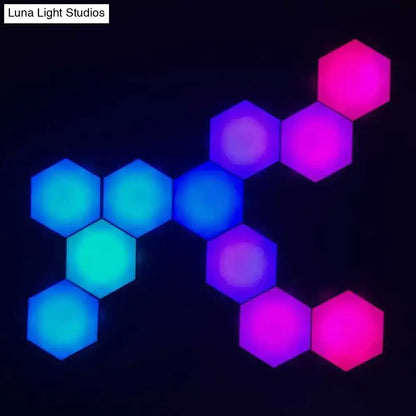Geometric hexagon led wall lights in blue teal purple and pink with bluetooth app control for bedroom ambiance