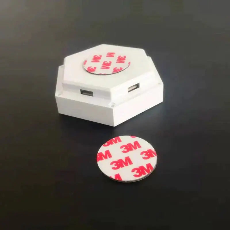 White hexagonal usb charging station with two ports and bluetooth app control for geometric hexagon led wall lights