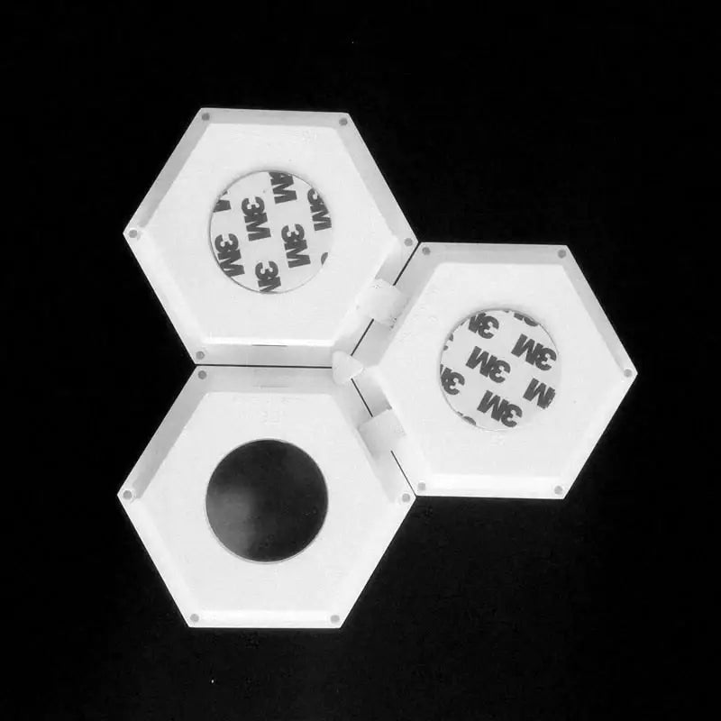 White hexagonal led wall light panel with adhesive backing featuring bluetooth app control for bedroom use