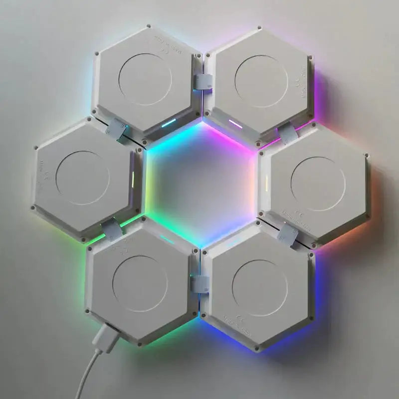 White hexagonal led wall lights arranged in a flower pattern emitting vibrant rainbow colors with bluetooth app control